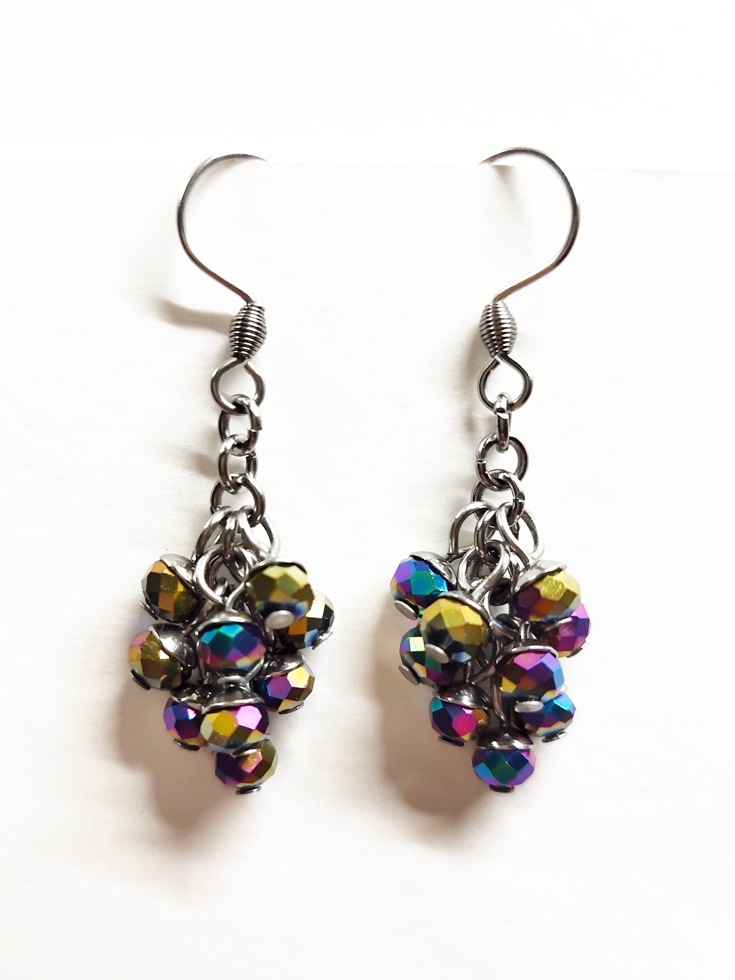 Dangling earrings with shiny purple colour beads