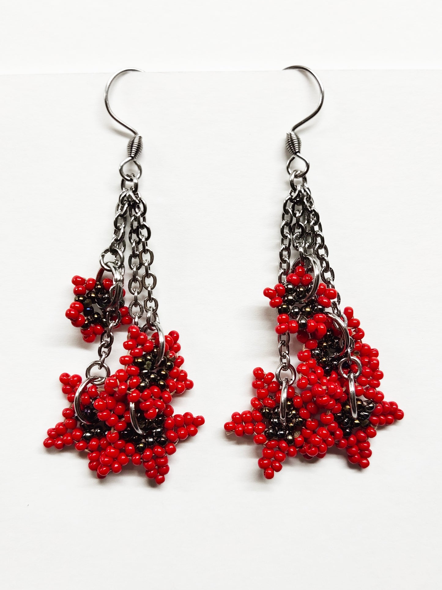 Long dangling earrings with beaded red stars