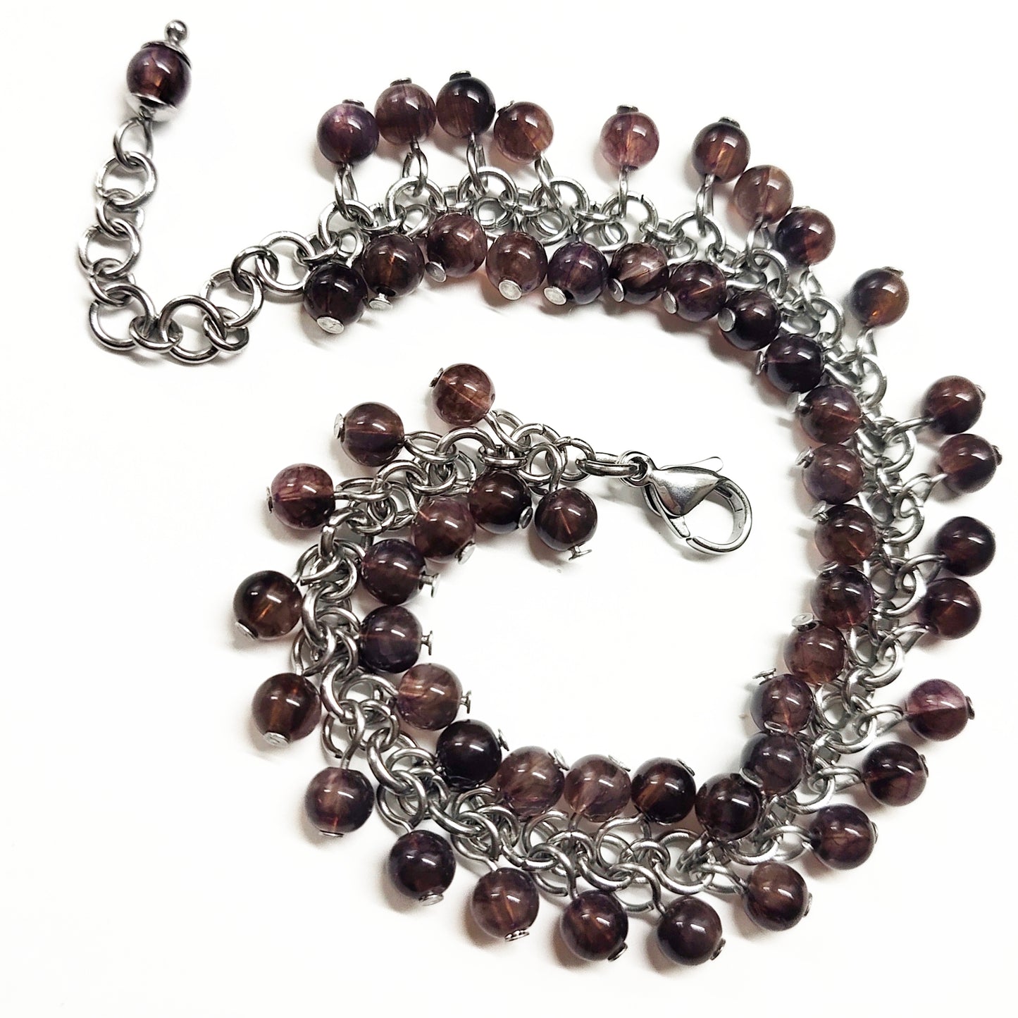 A set of brown beads bracelet and dangling earrings