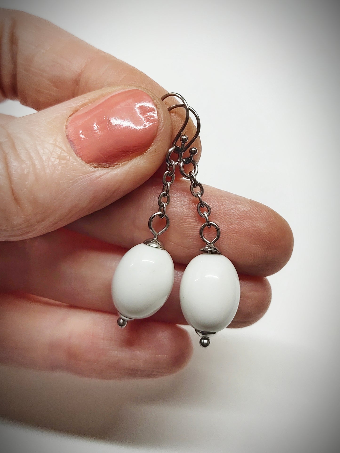 Matching off-white oval beads earrings for mother and daughter