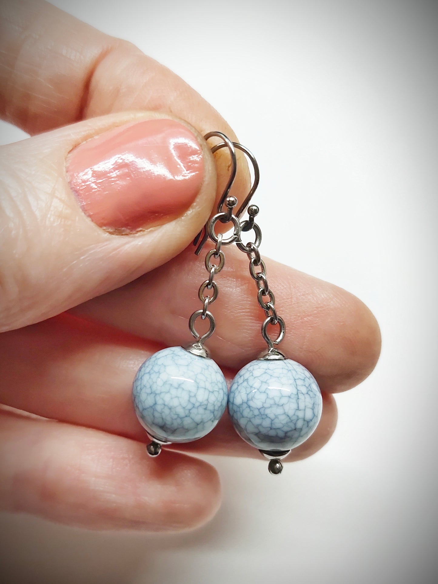 Matching greyish bead earrings for mother and daughter