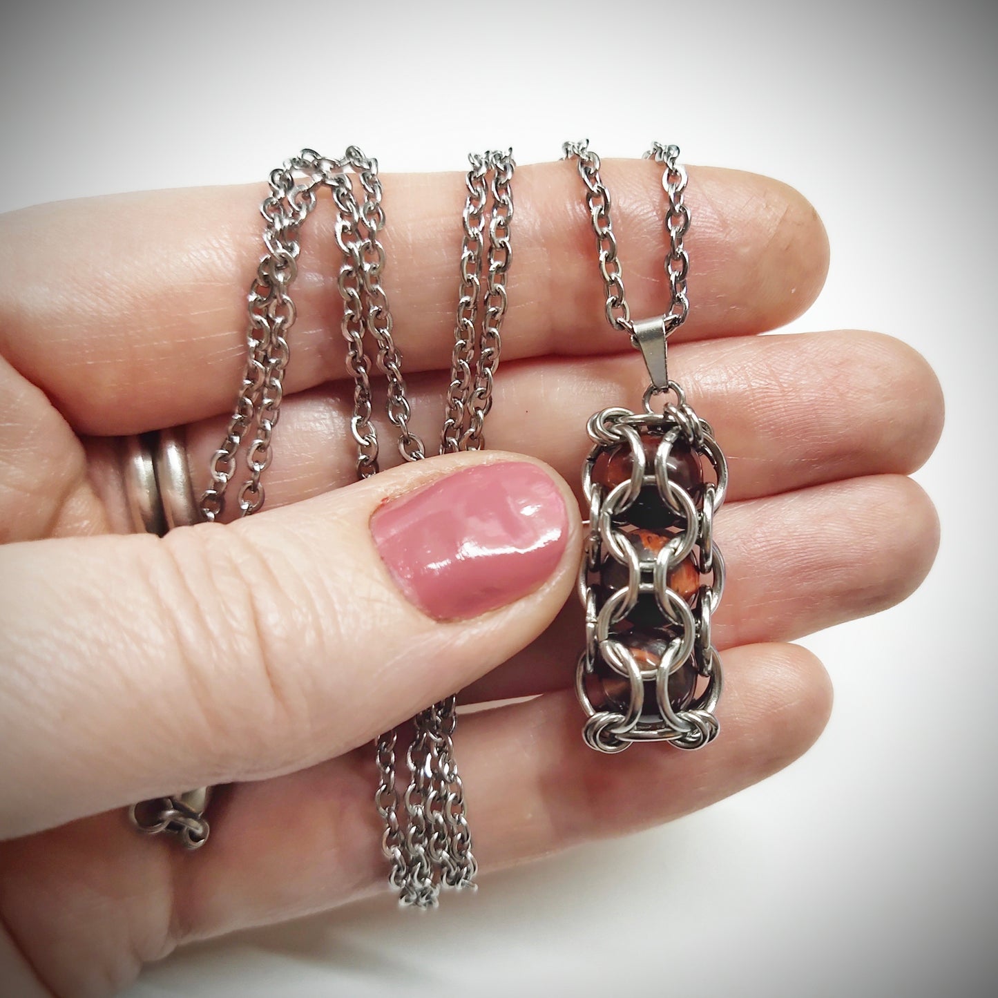 Brown caged beads pendant with stainless steel chain