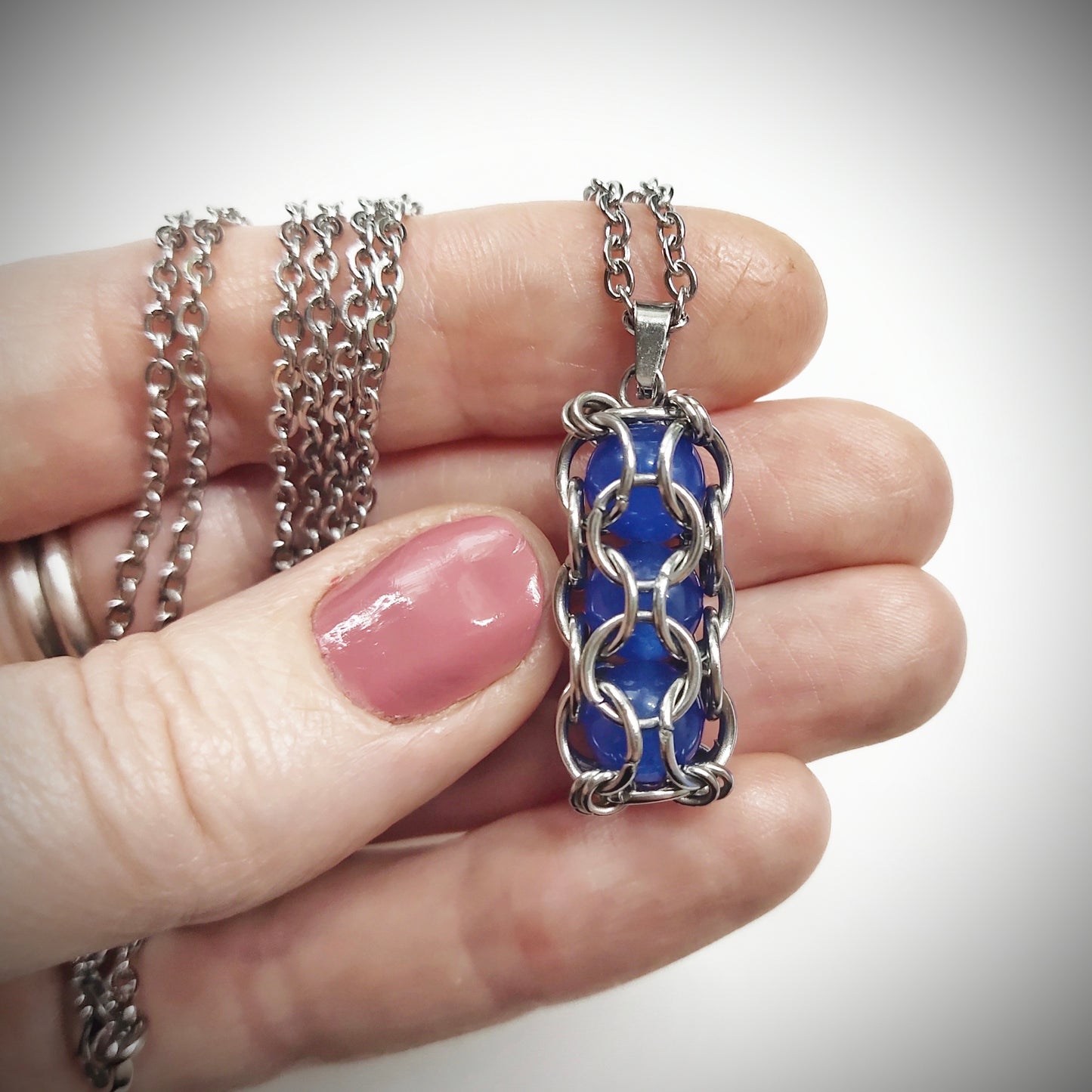 Blue caged beads pendant with stainless steel chain