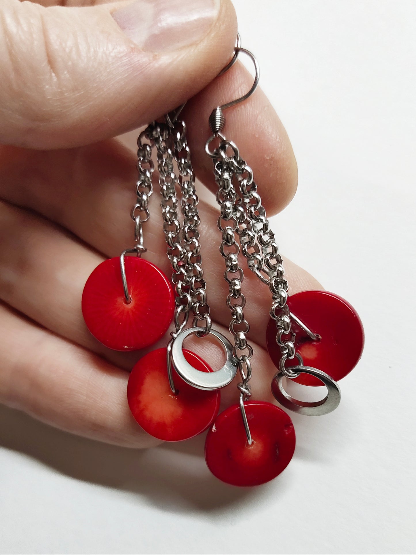 Dangling earrings with red shell disc beads