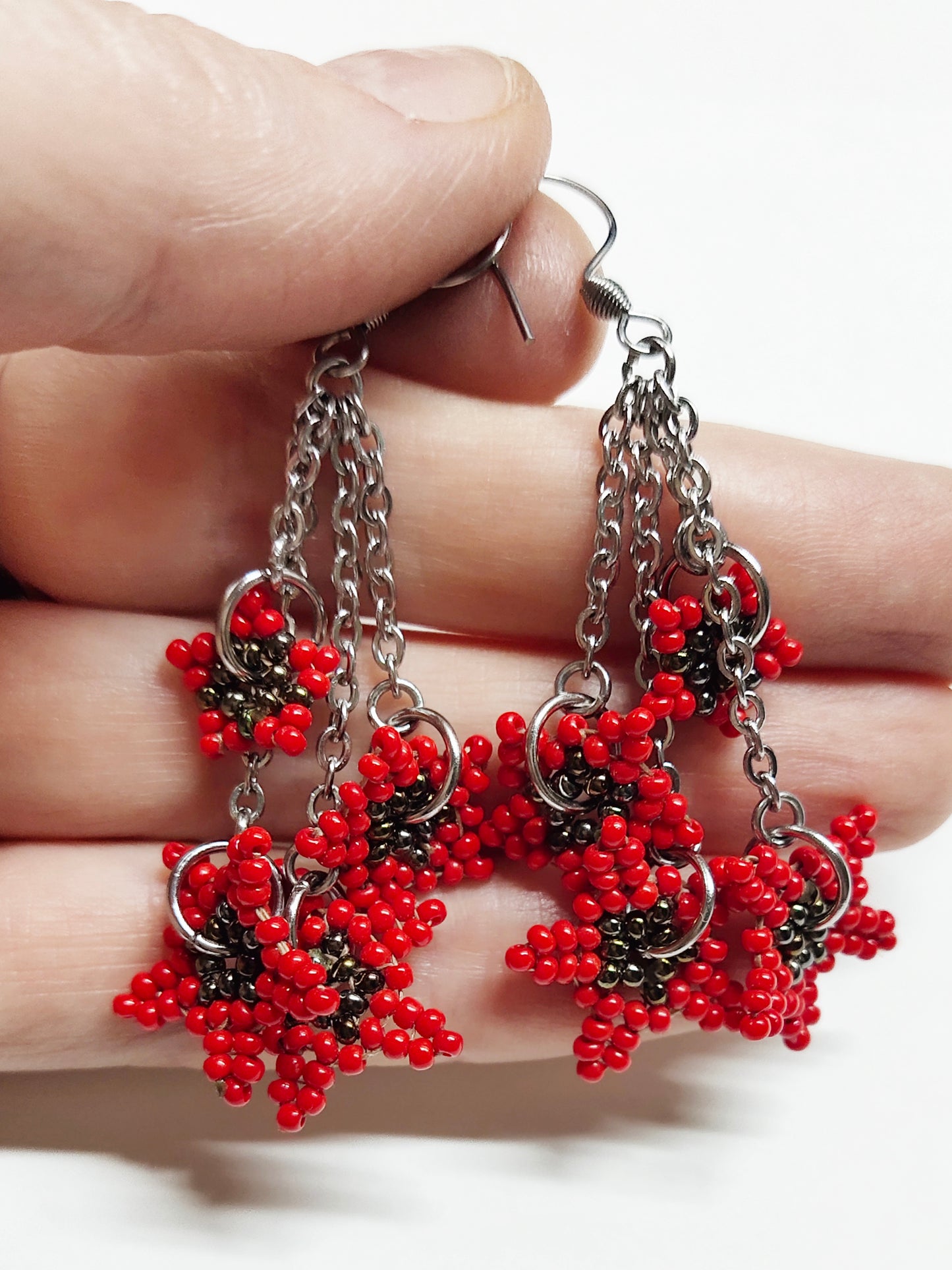 Long dangling earrings with beaded red stars
