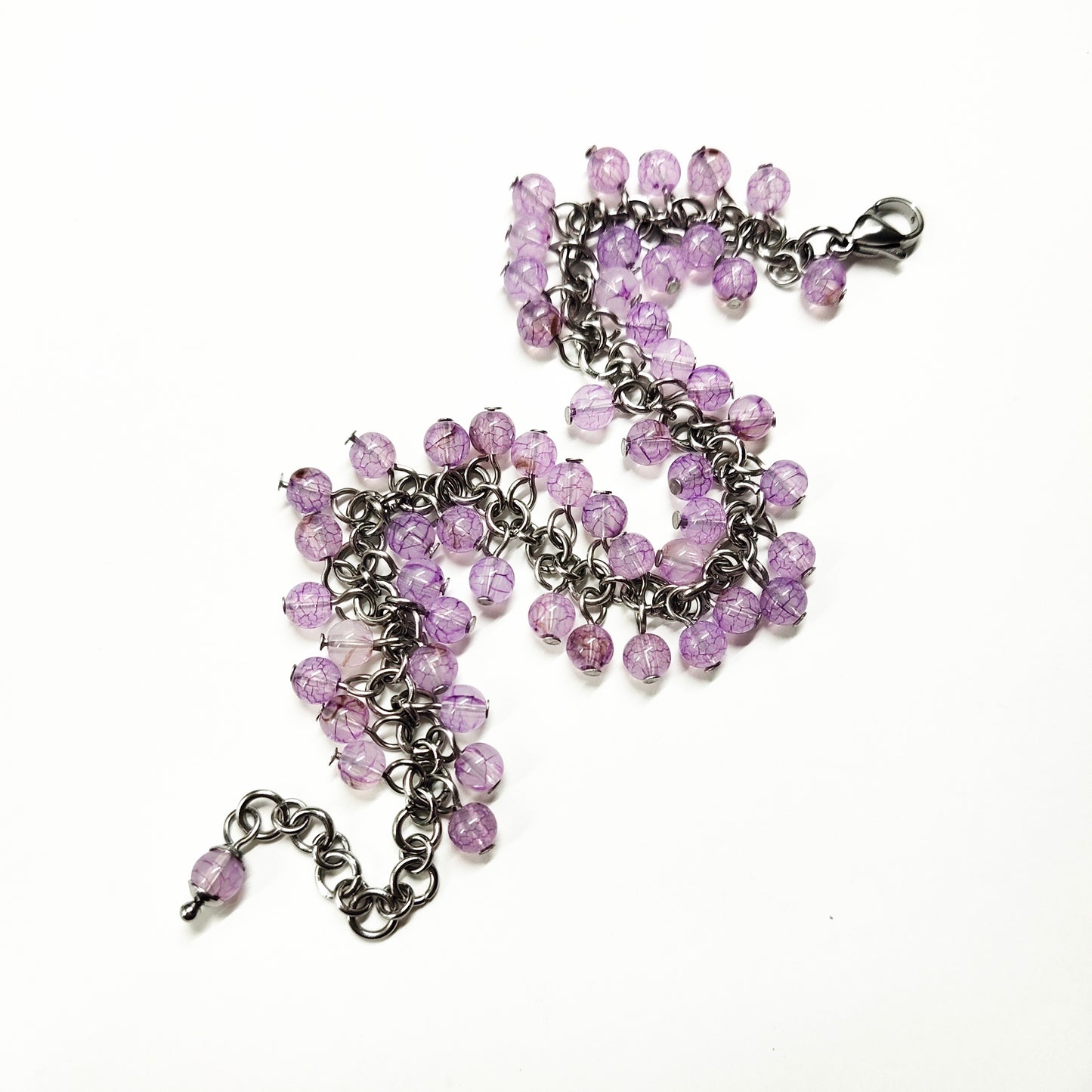 A set of light purple beads bracelet and dangling earrings