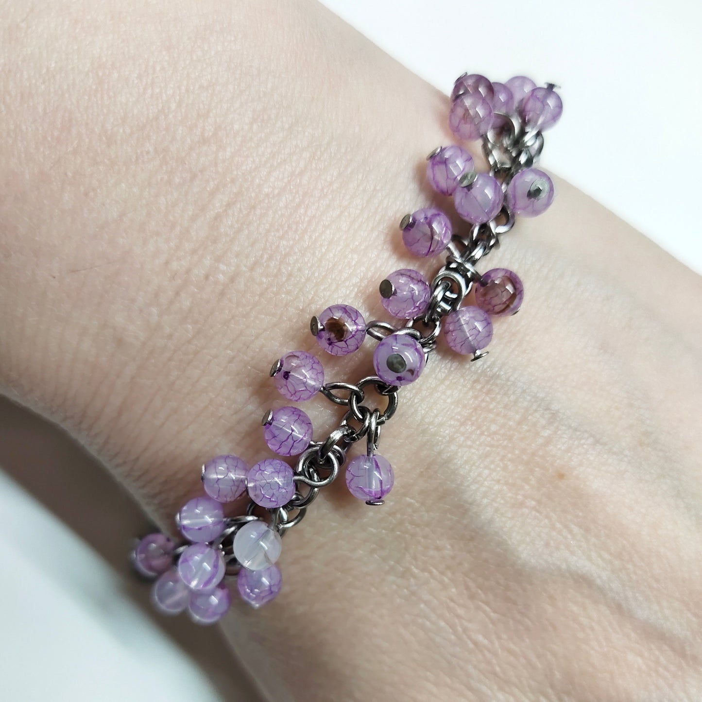 A set of light purple beads bracelet and dangling earrings
