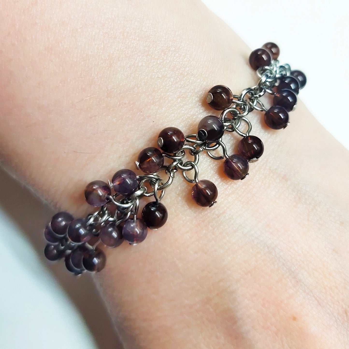 A set of brown beads bracelet and dangling earrings