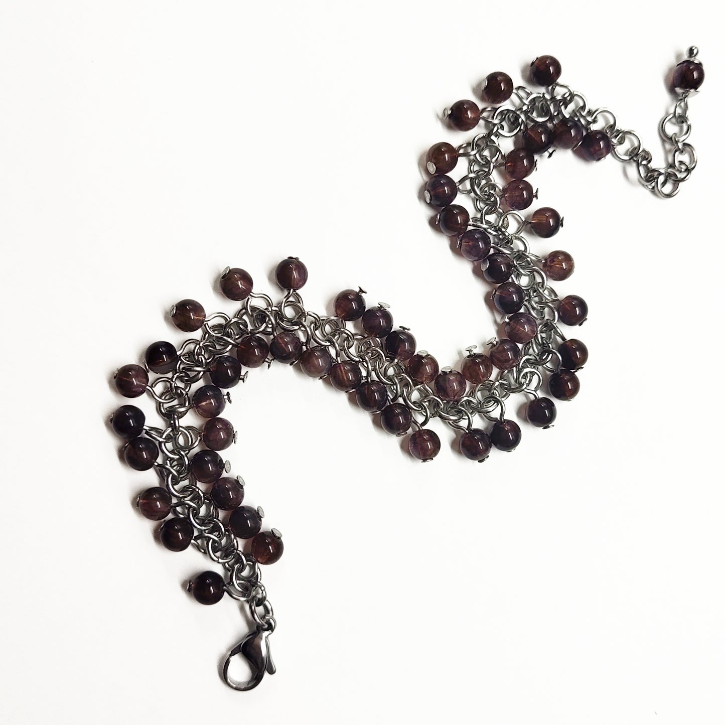 A set of brown beads bracelet and dangling earrings
