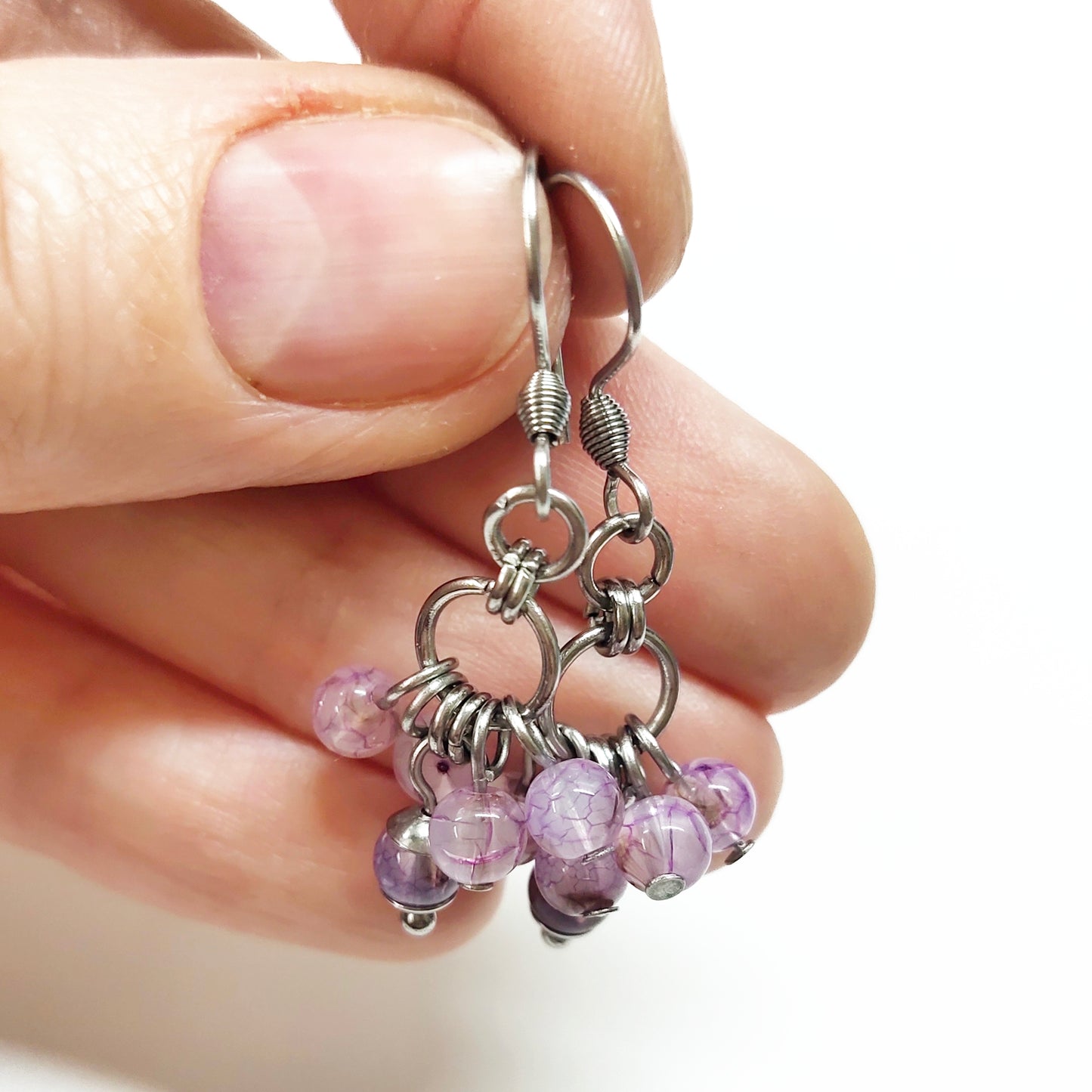 A set of light purple beads bracelet and dangling earrings