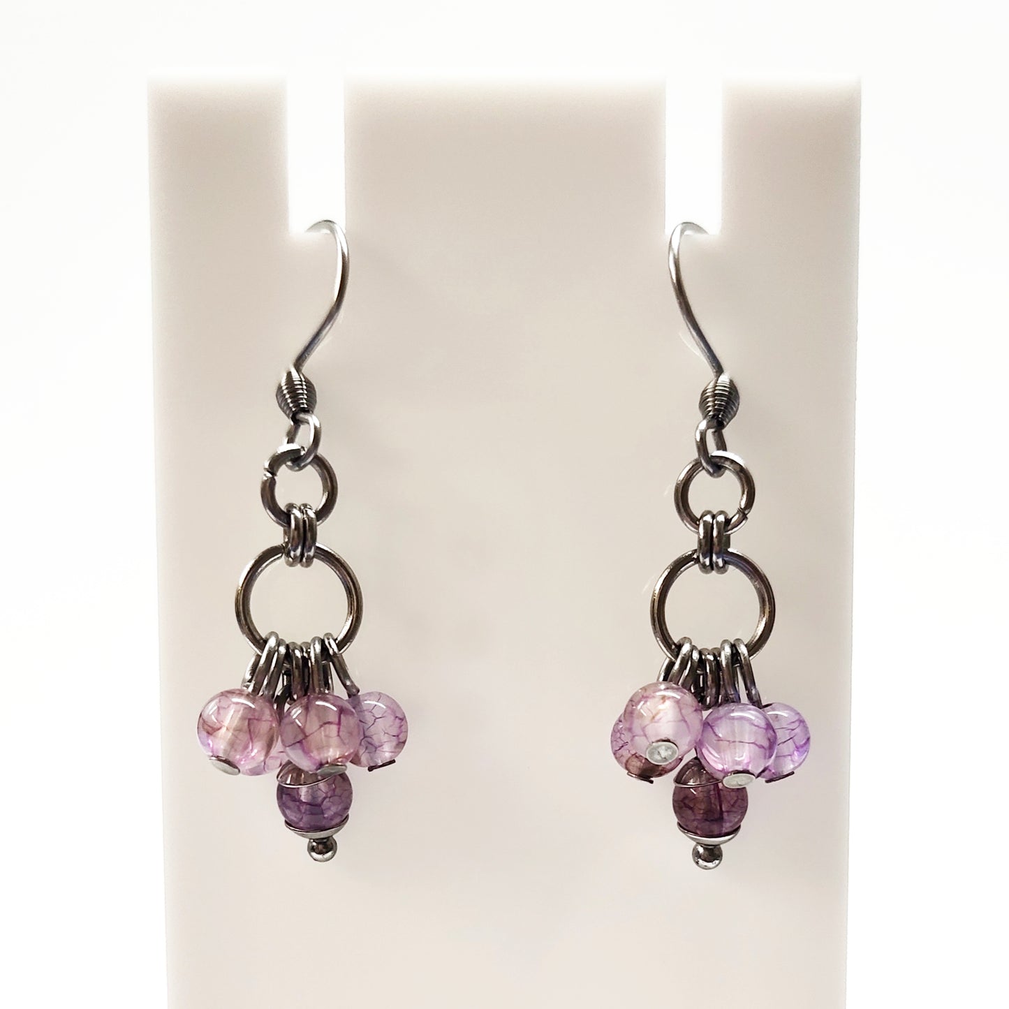 A set of light purple beads bracelet and dangling earrings