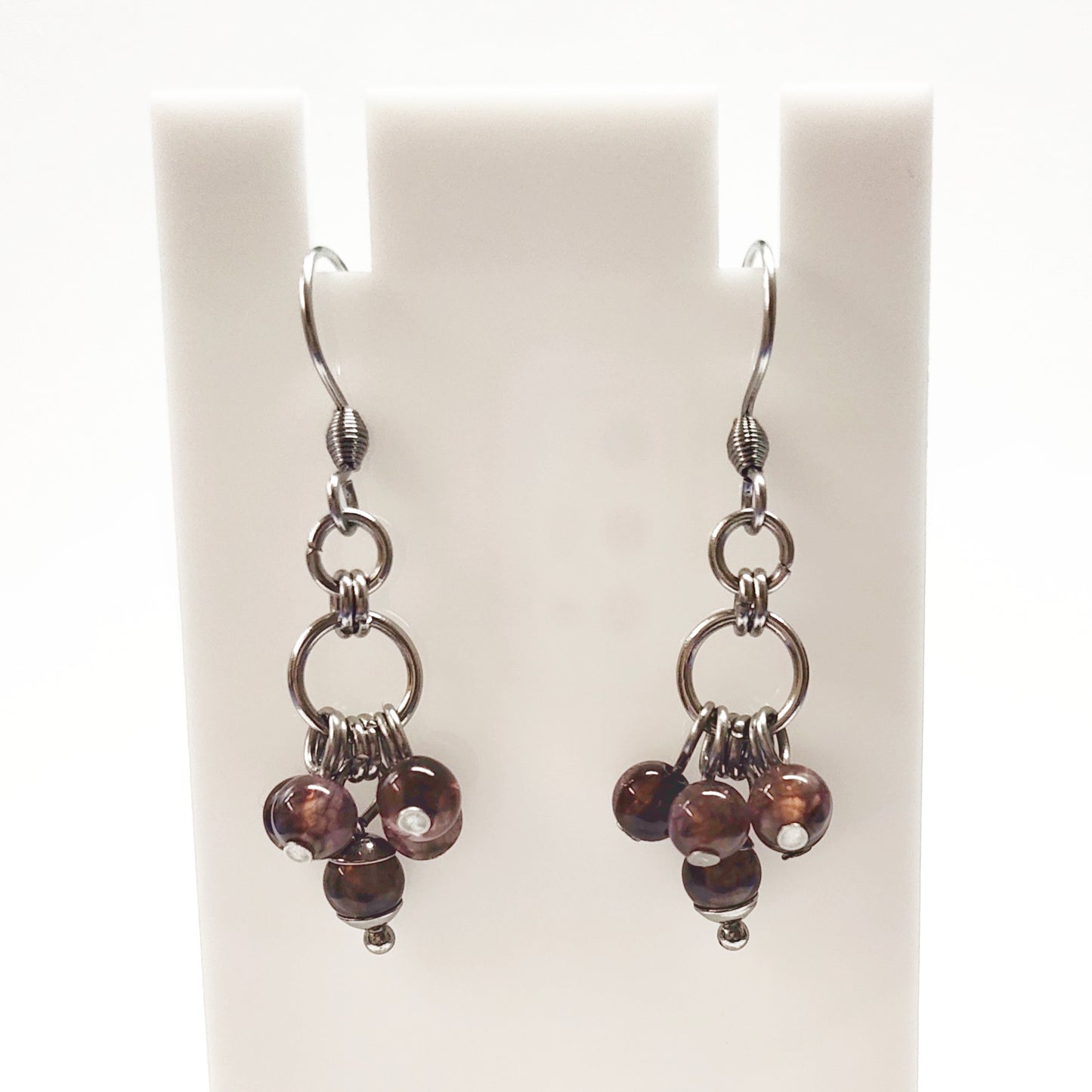 A set of brown beads bracelet and dangling earrings