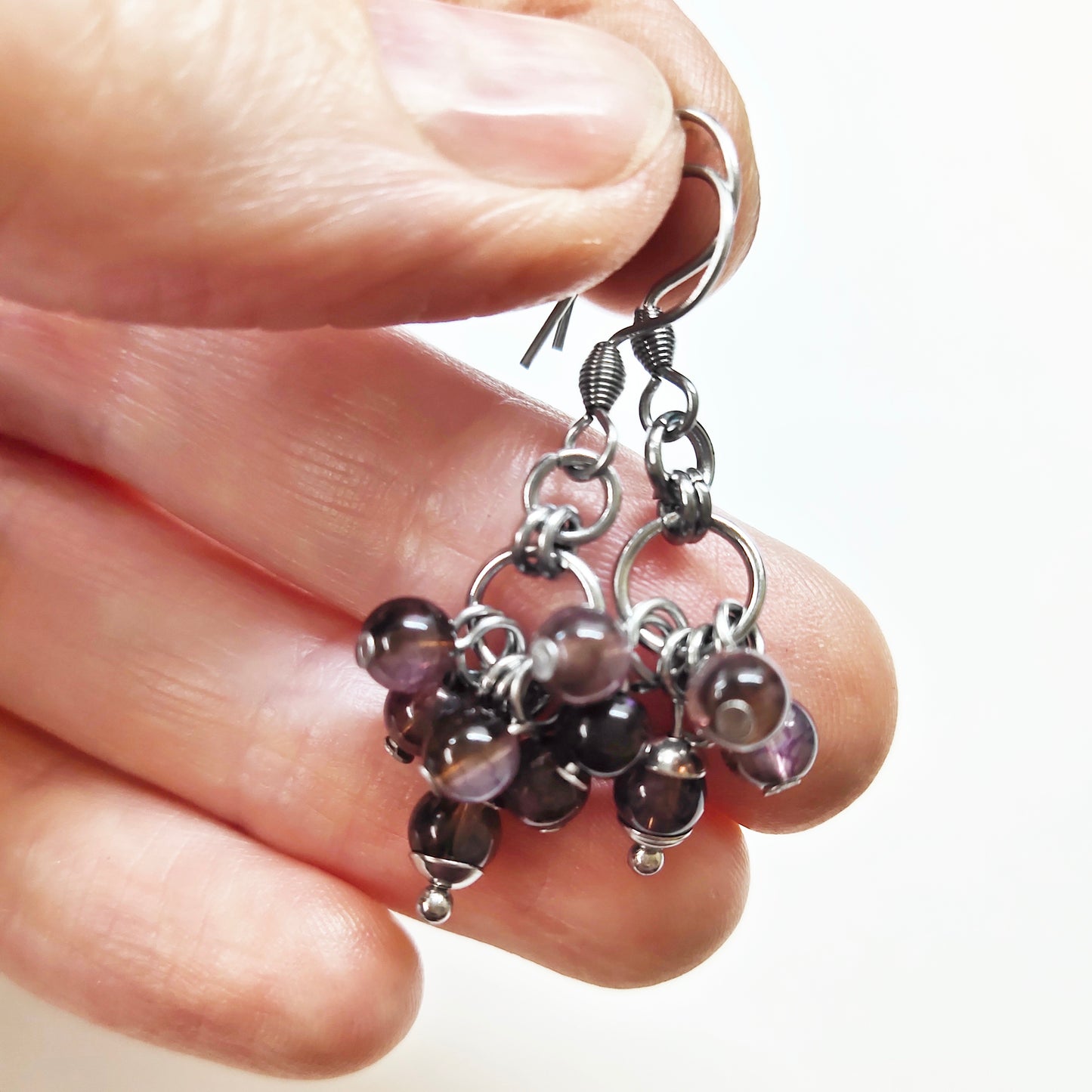 A set of brown beads bracelet and dangling earrings