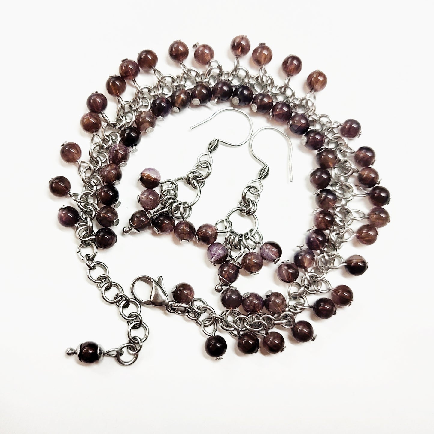 A set of brown beads bracelet and dangling earrings