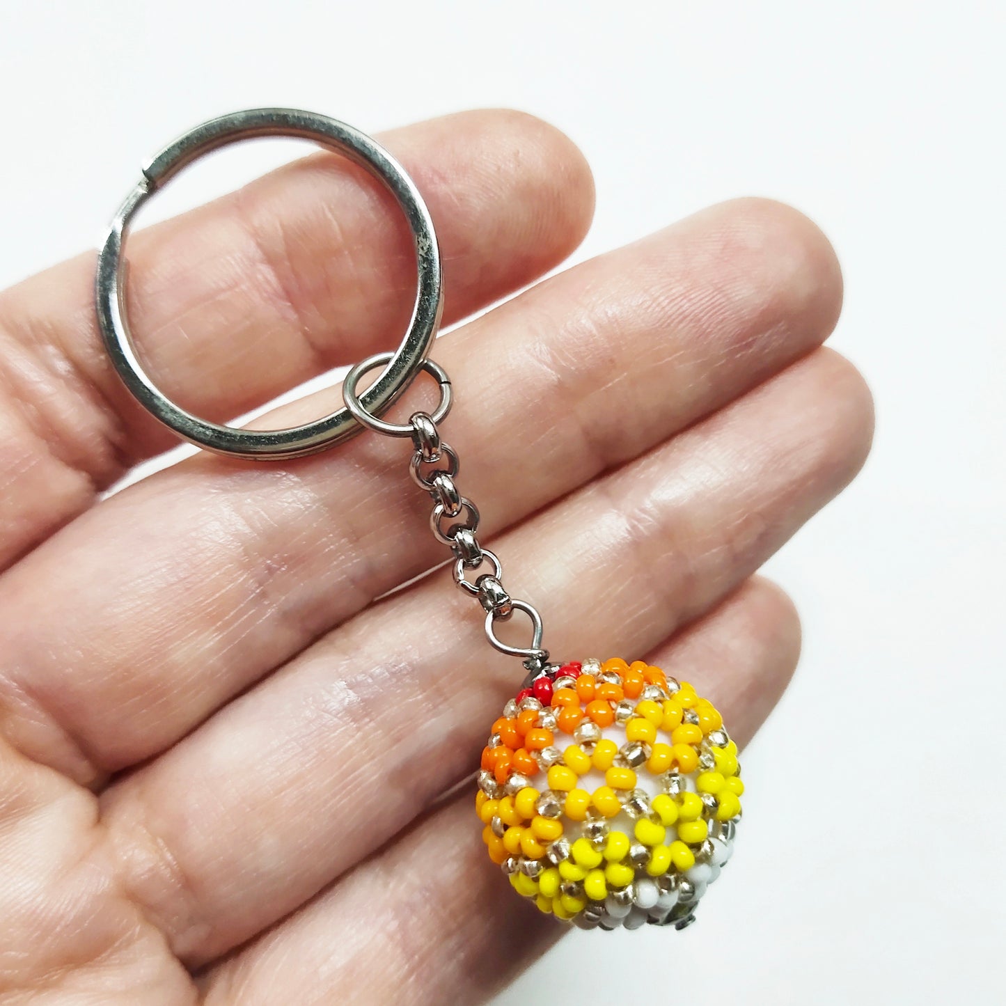 Beaded ball keychain with lines pattern