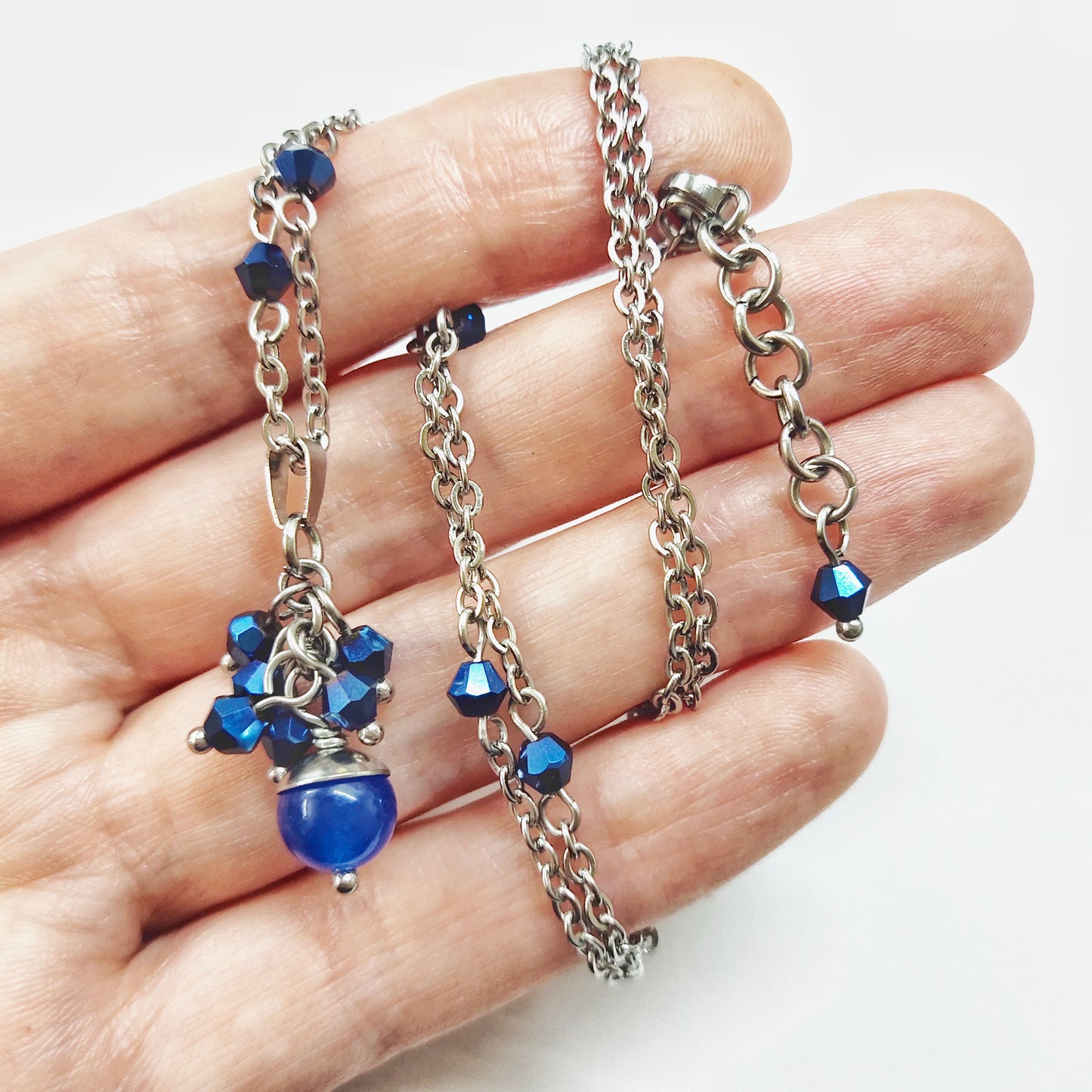 A set of blue beads necklace and earrings