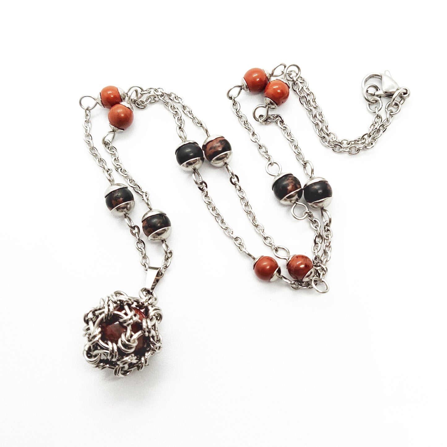 Two matching necklaces with black, brown and yellow stones and a pendant #0001