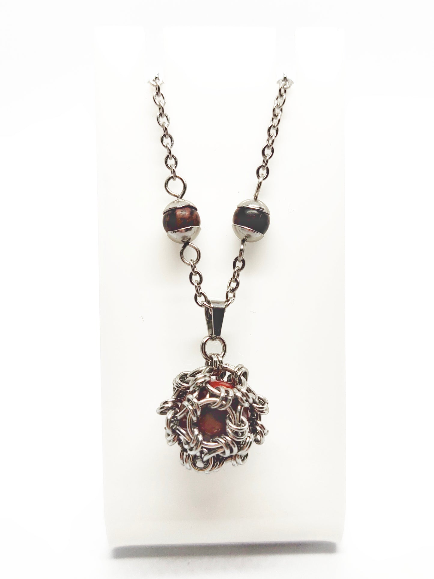 Two matching necklaces with black, brown and yellow stones and a pendant #0001