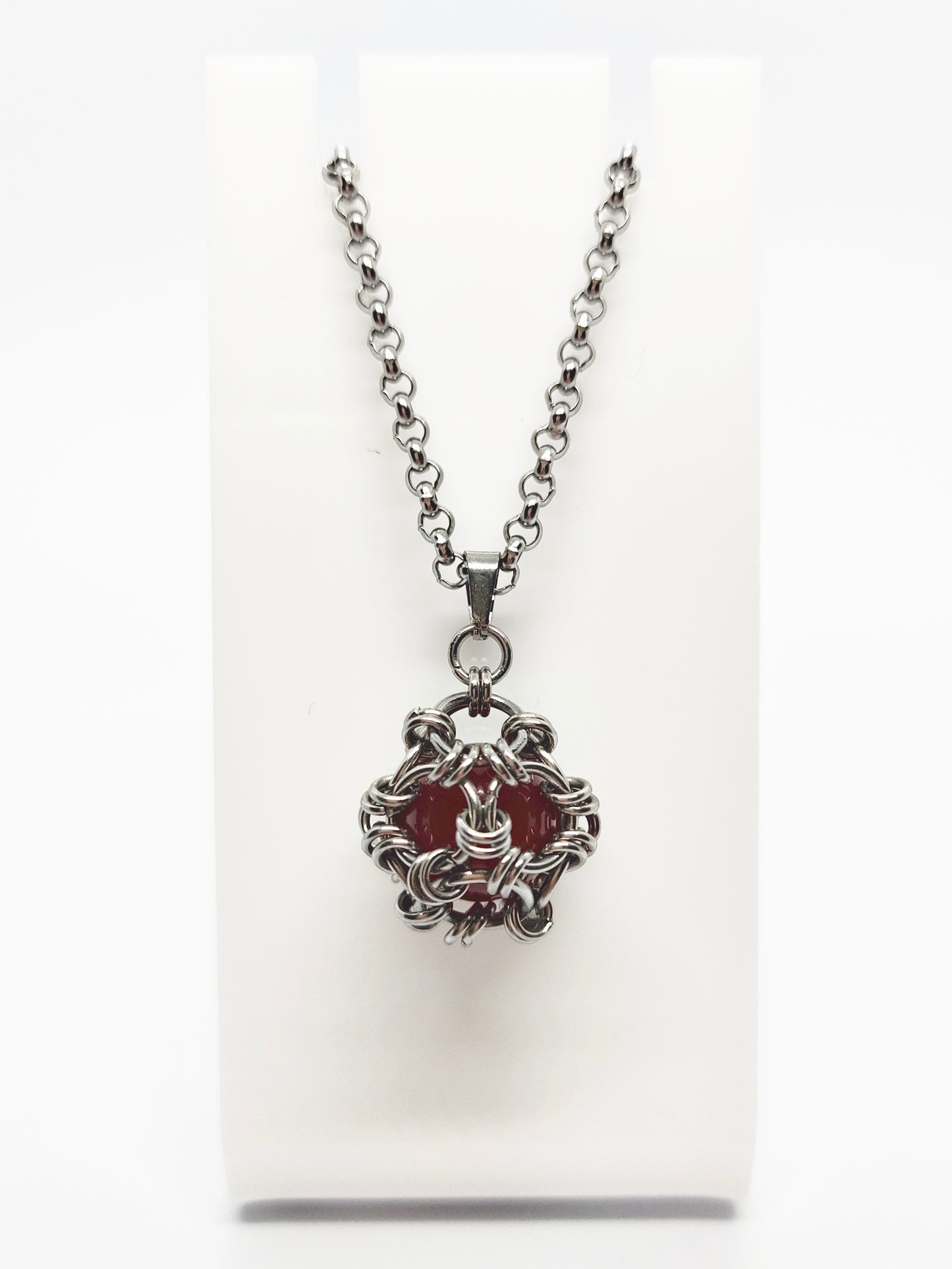 Two matching necklaces with semi-translucent reddish brown stones and a pendant #0006