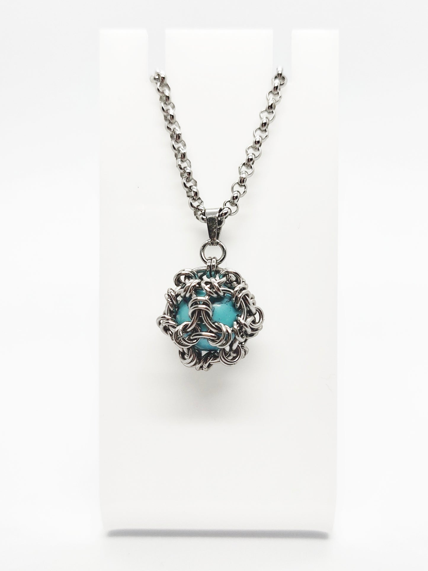 Two matching necklaces with light blue stones and a pendant #0003
