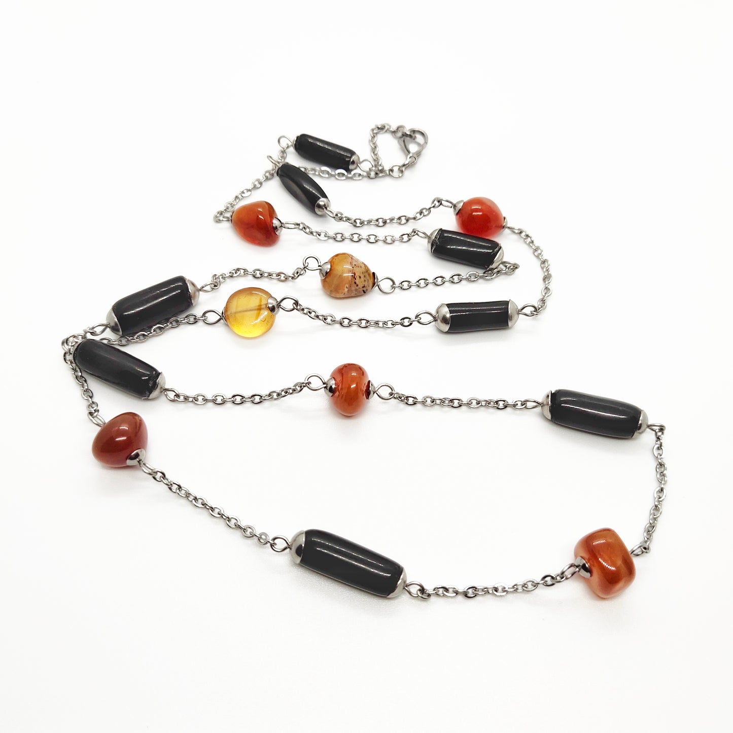 Two matching necklaces with black, brown and yellow stones and a pendant #0001