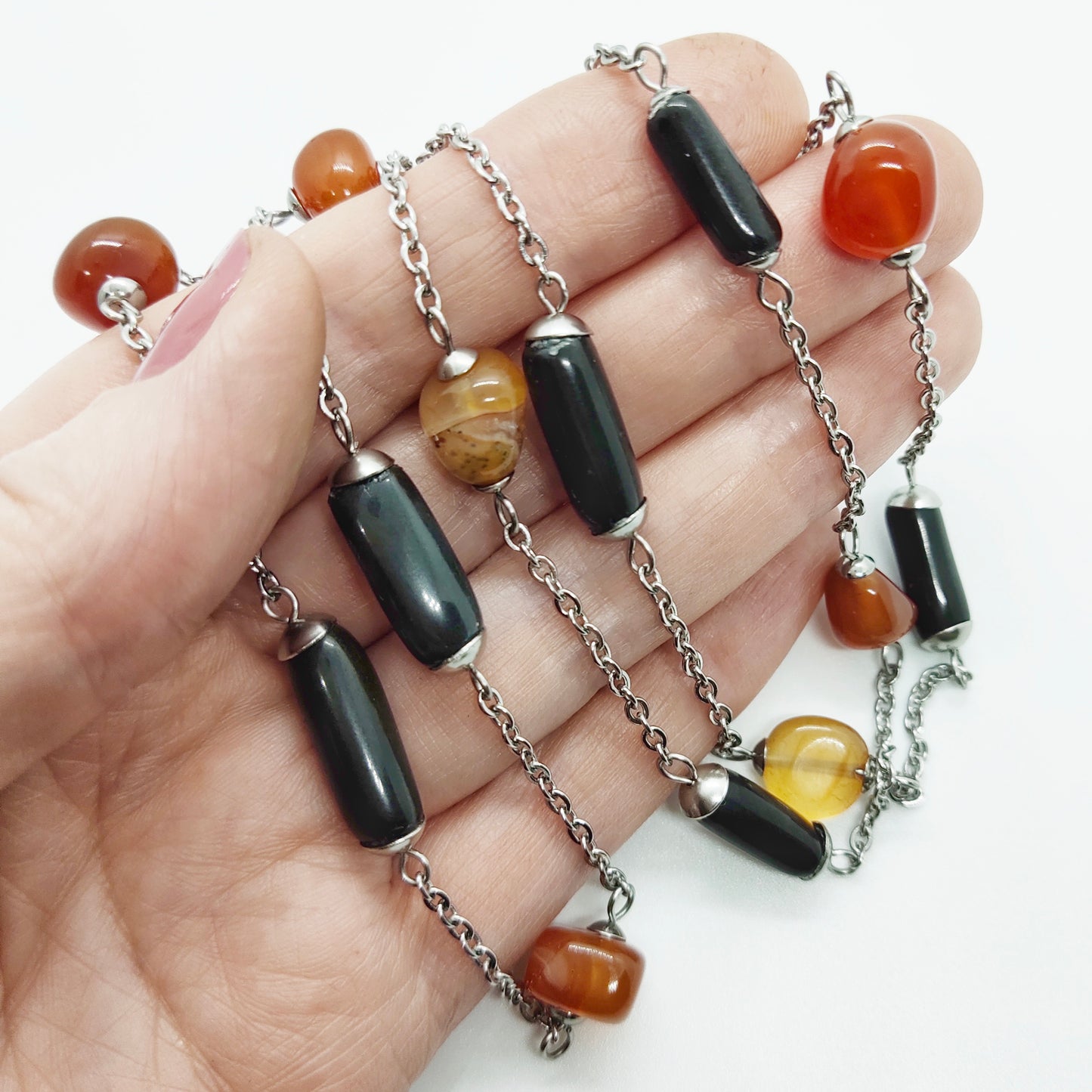 Two matching necklaces with black, brown and yellow stones and a pendant #0001