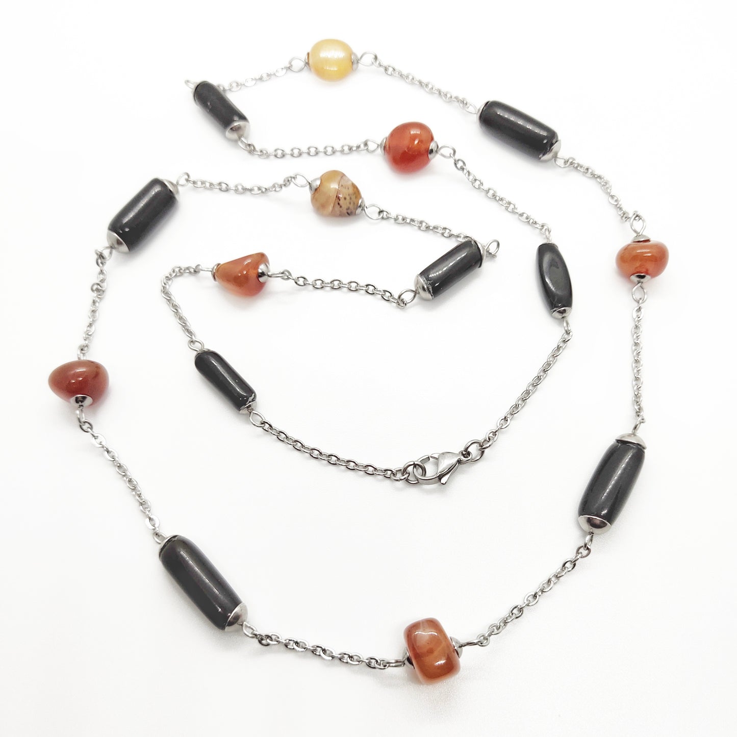 Two matching necklaces with black, brown and yellow stones and a pendant #0001