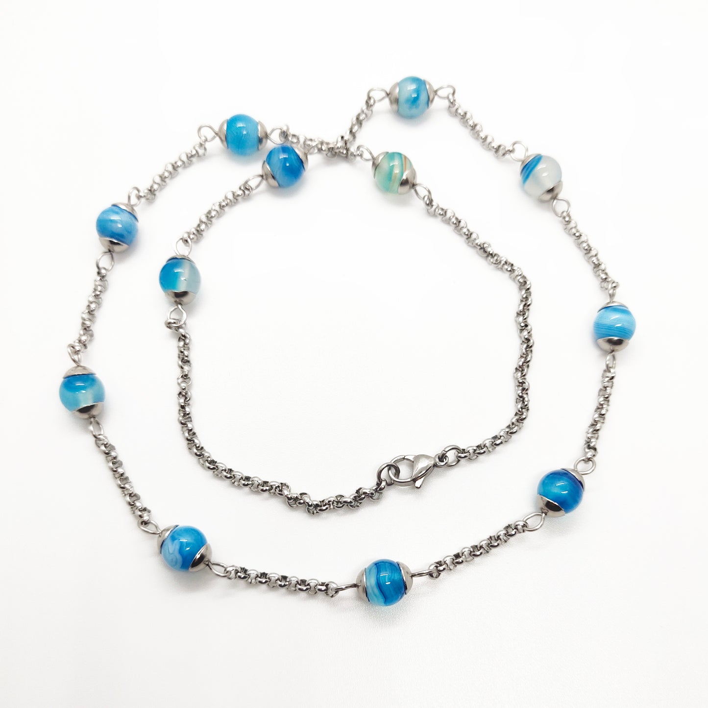 Two matching necklaces with light blue stones and a pendant #0003