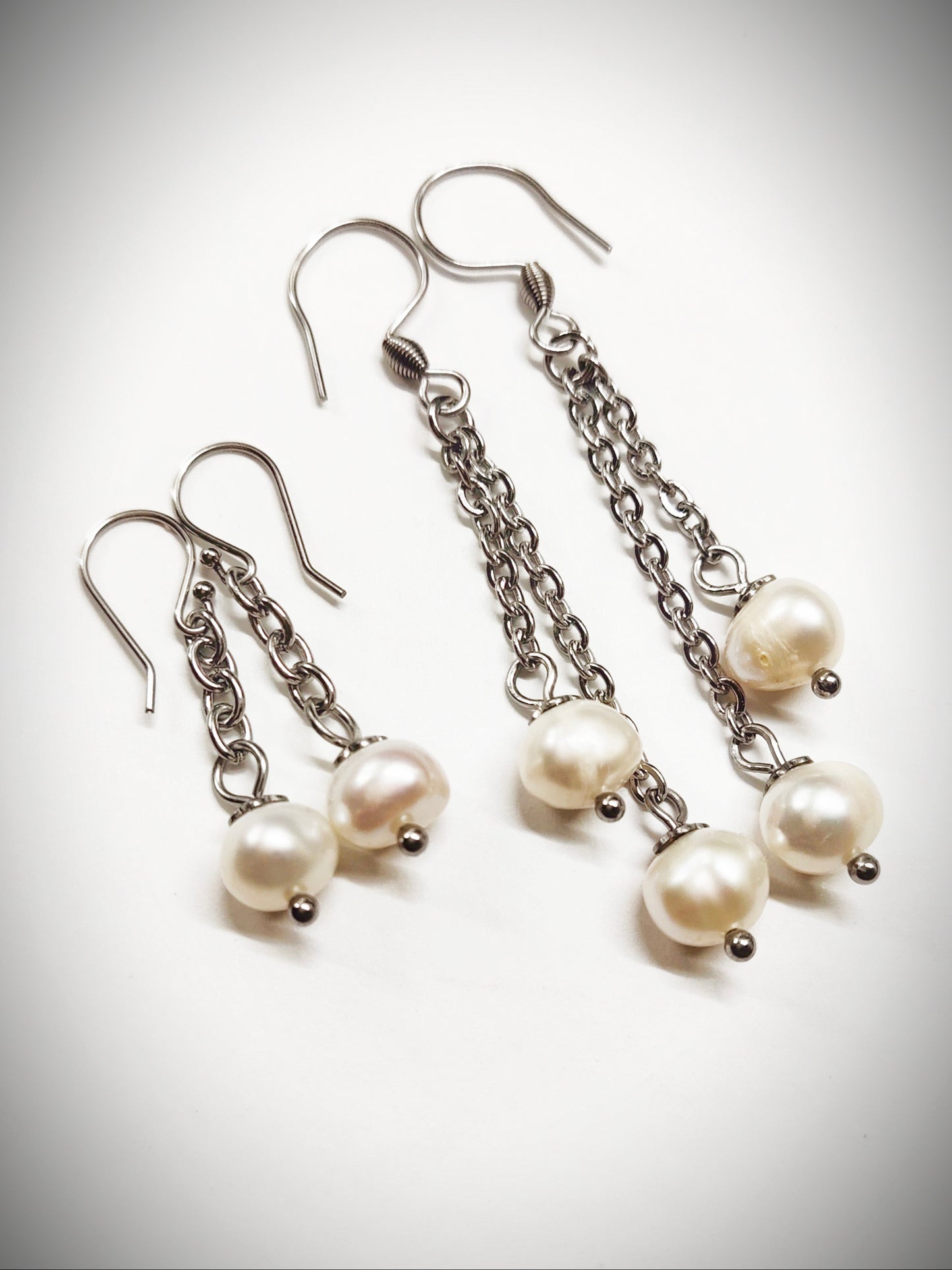 Matching off-white pearl earrings for mother and daughter