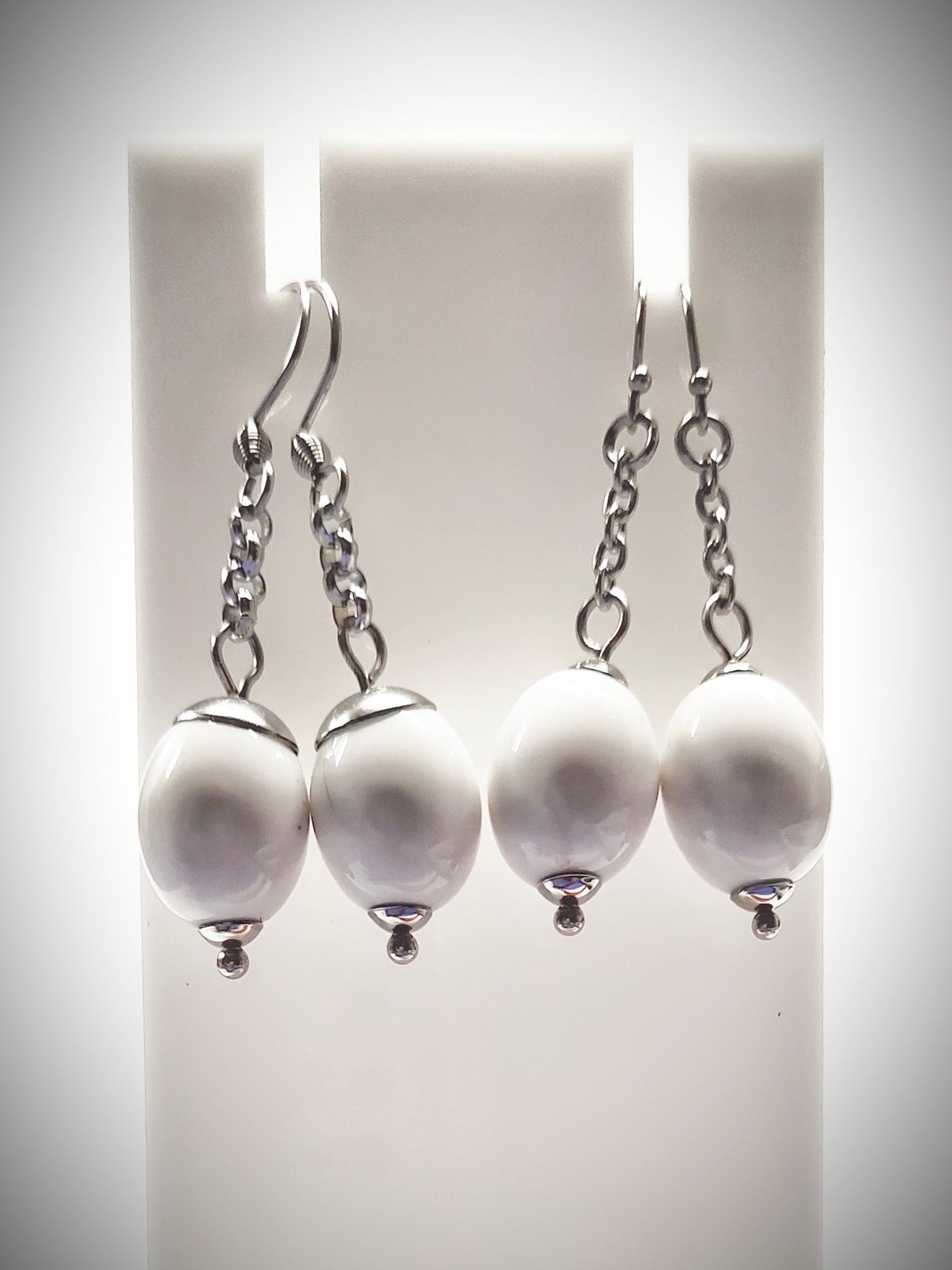 Matching off-white oval beads earrings for mother and daughter