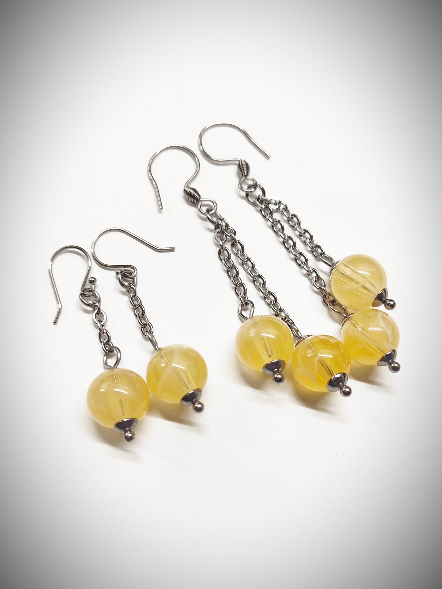 Matching semi clear yellowish bead earrings for mother and daughter