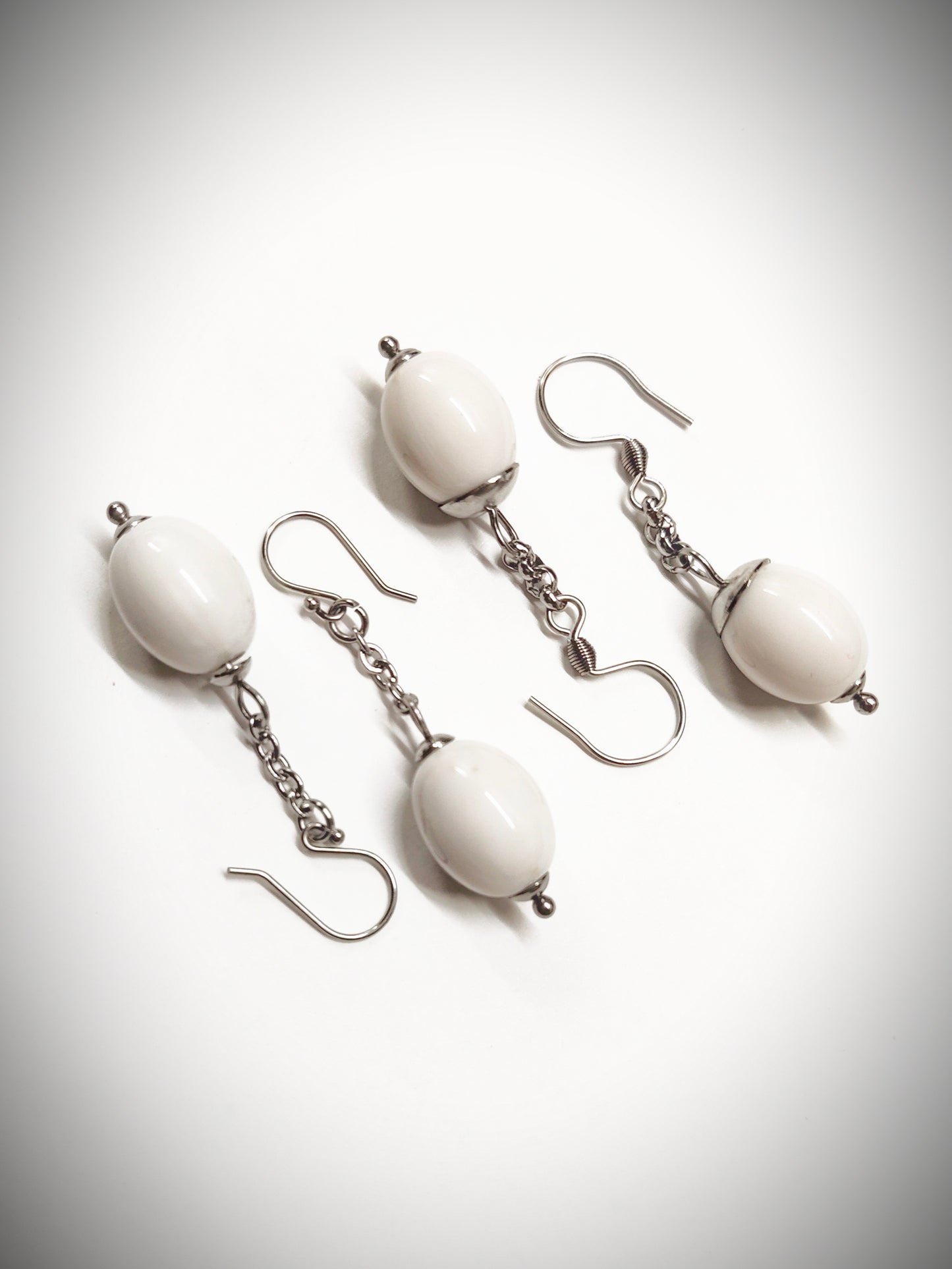 Matching off-white oval beads earrings for mother and daughter