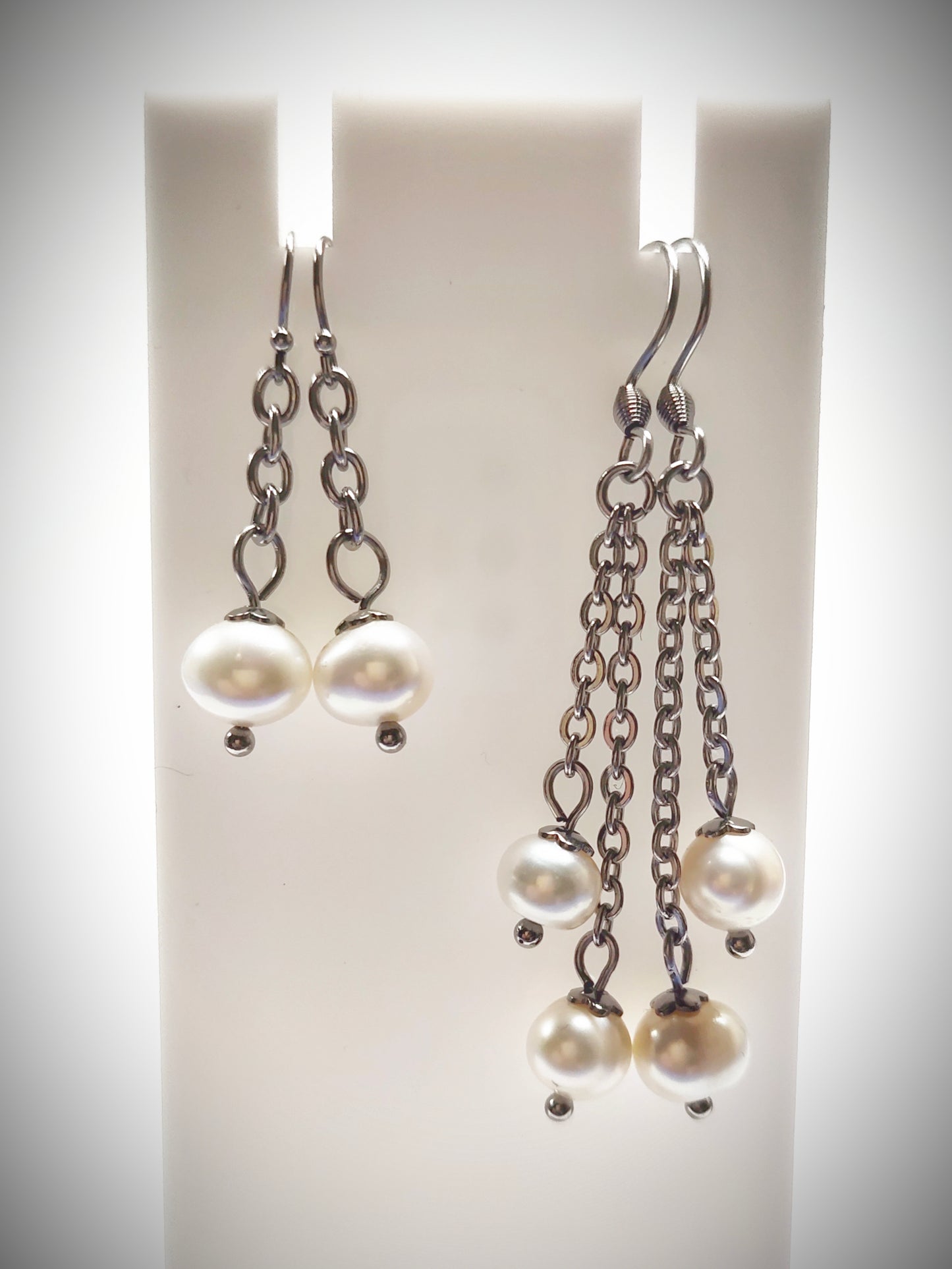 Matching off-white pearl earrings for mother and daughter