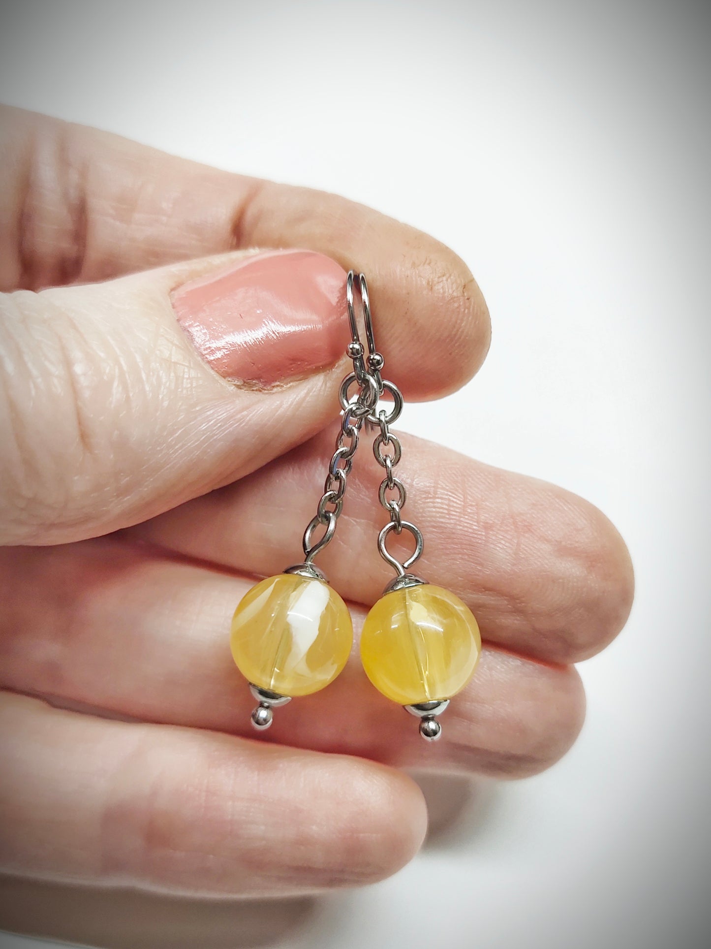 Matching semi clear yellowish bead earrings for mother and daughter