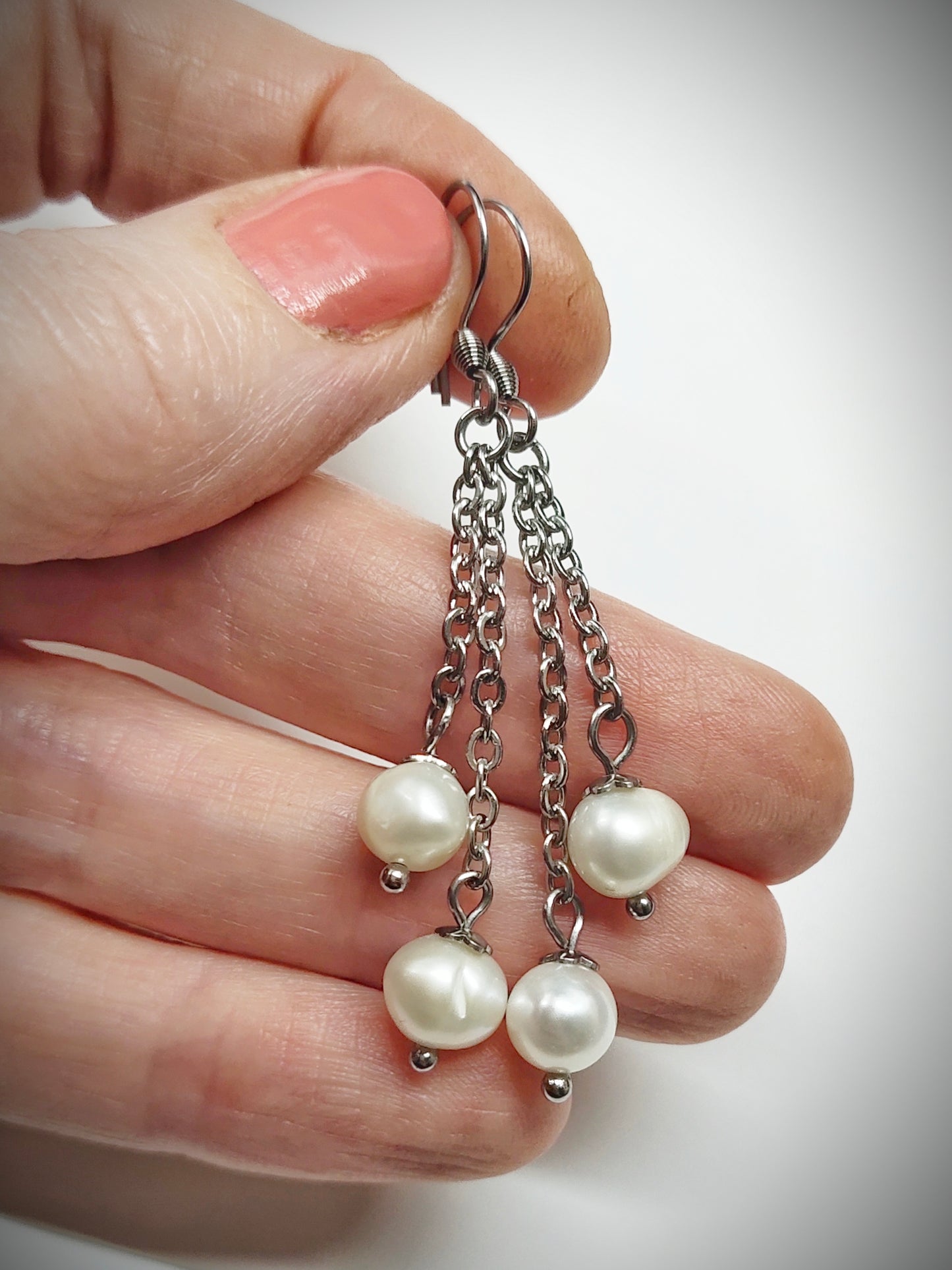 Matching off-white pearl earrings for mother and daughter