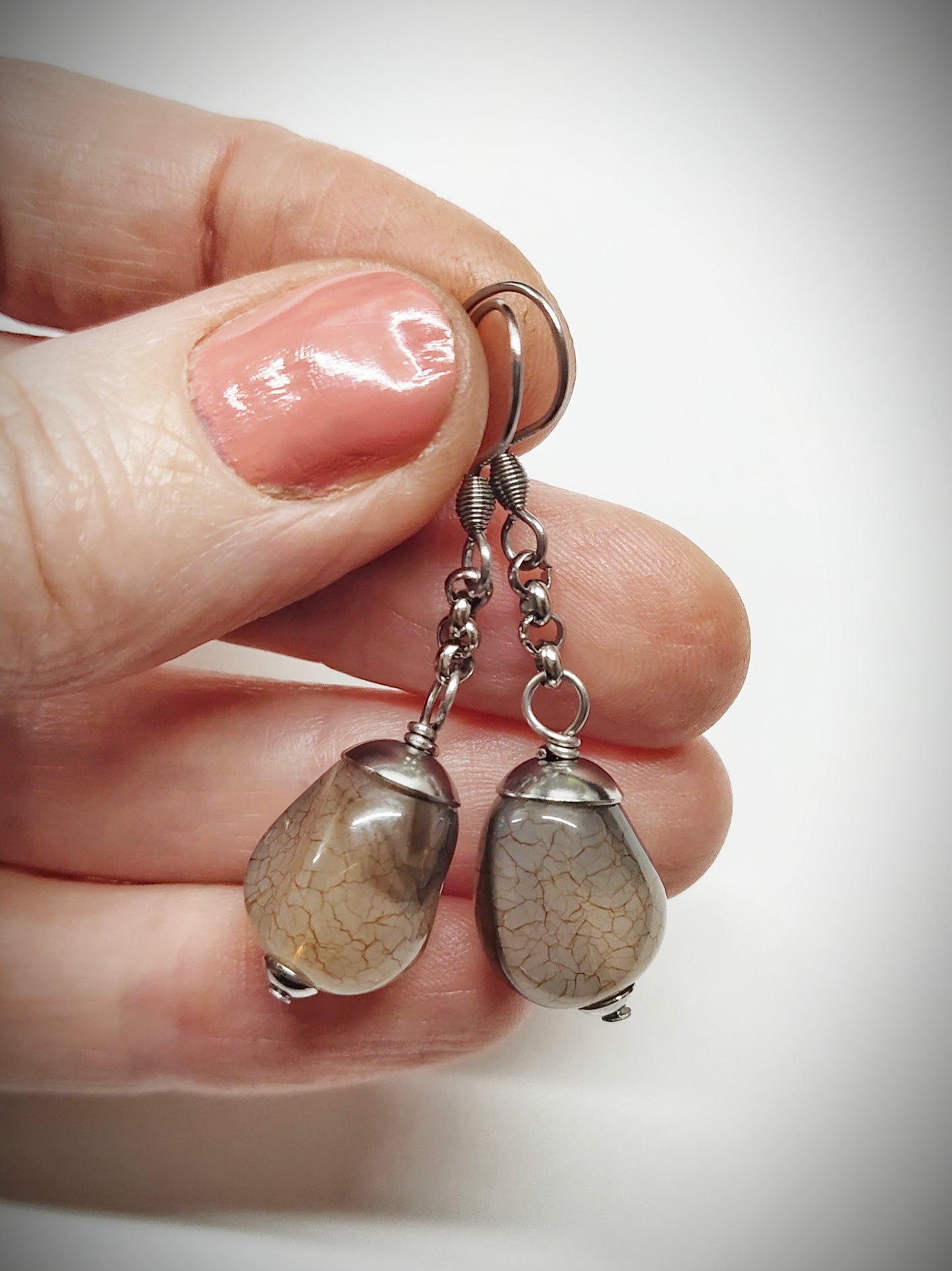 Matching greyish brown bead earrings for mother and daughter