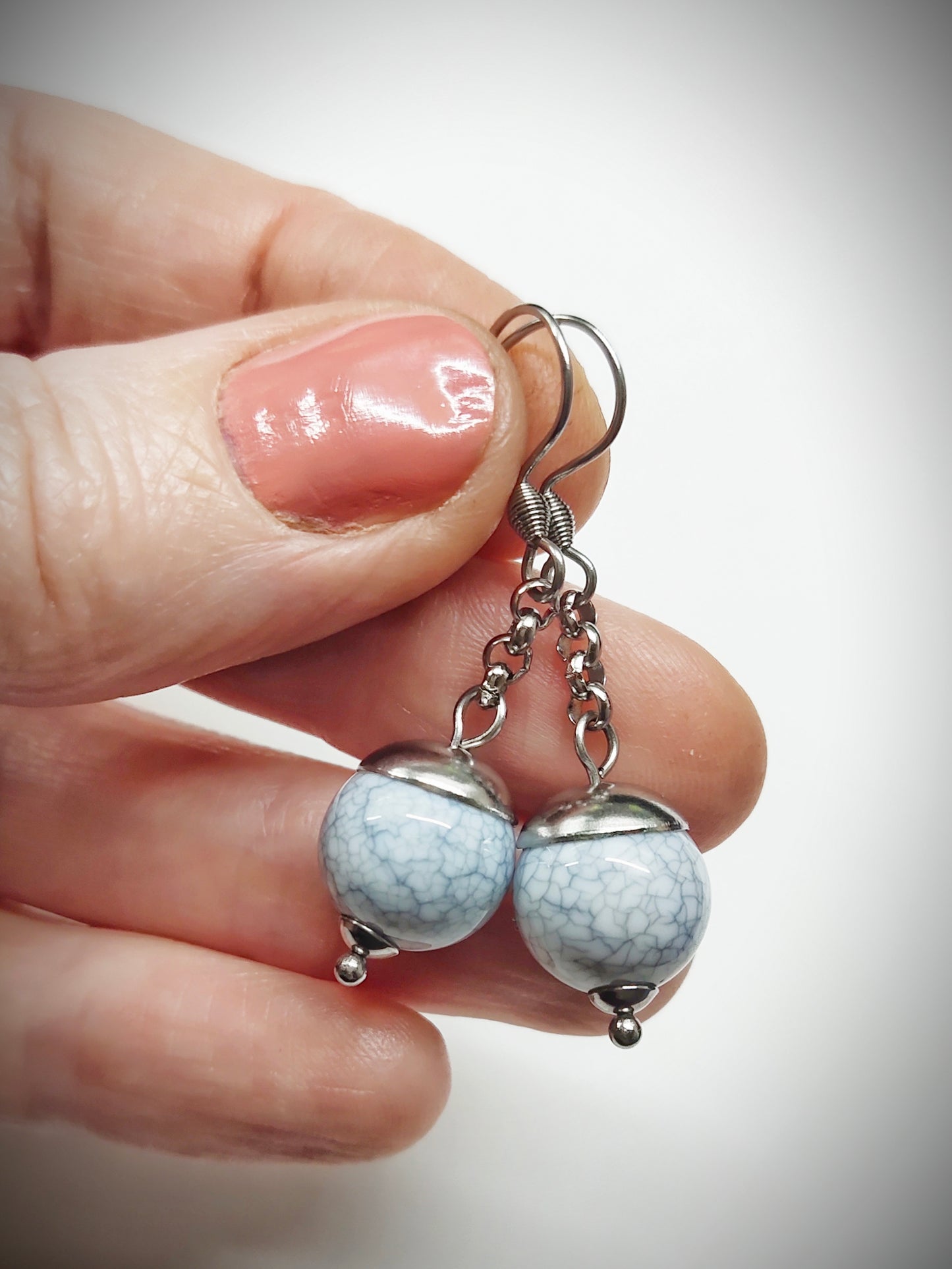 Matching greyish bead earrings for mother and daughter