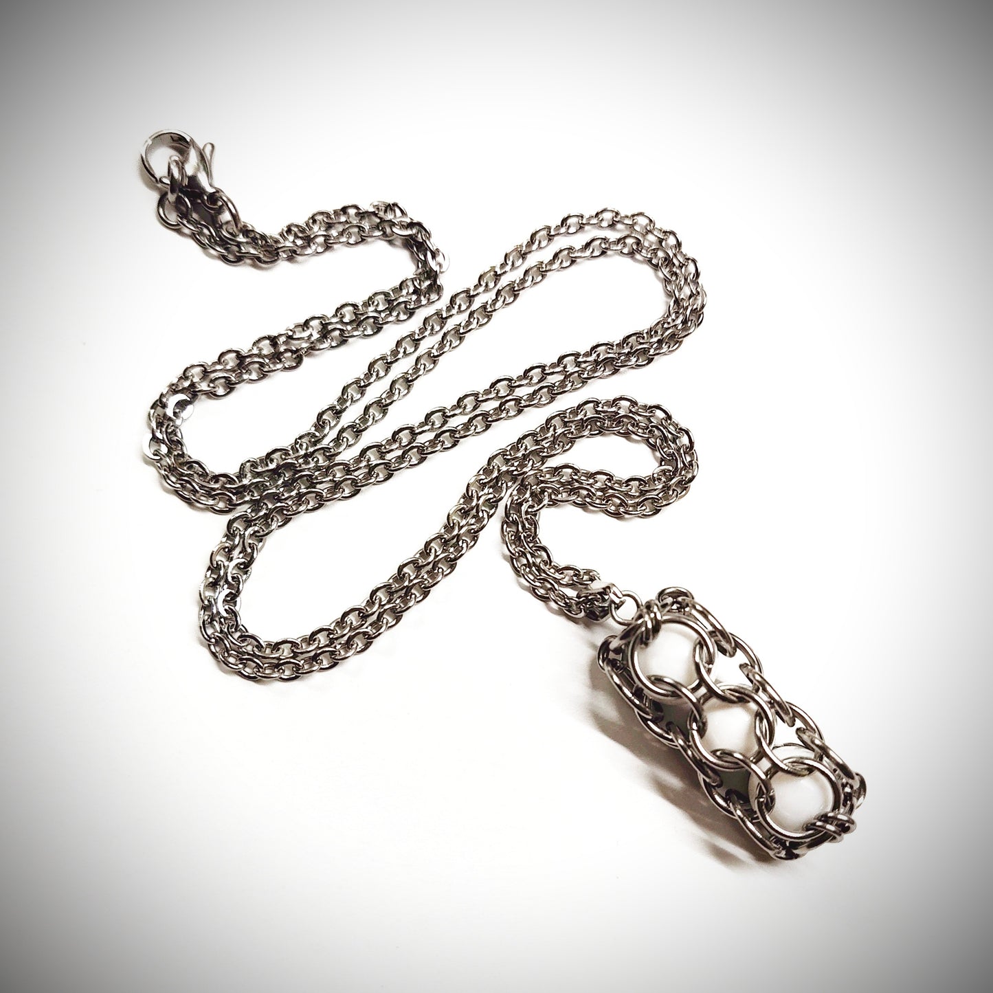 White caged beads pendant with stainless steel chain