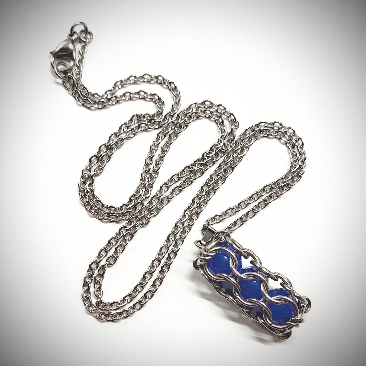 Blue caged beads pendant with stainless steel chain
