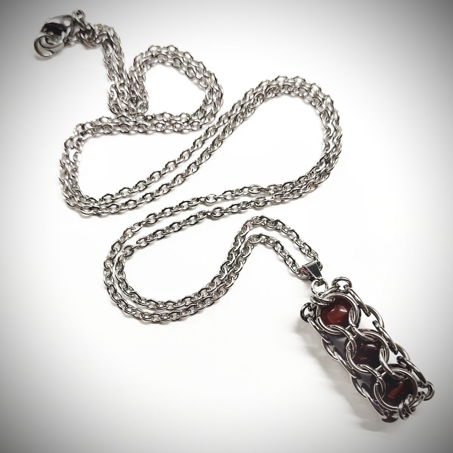 Brown caged beads pendant with stainless steel chain