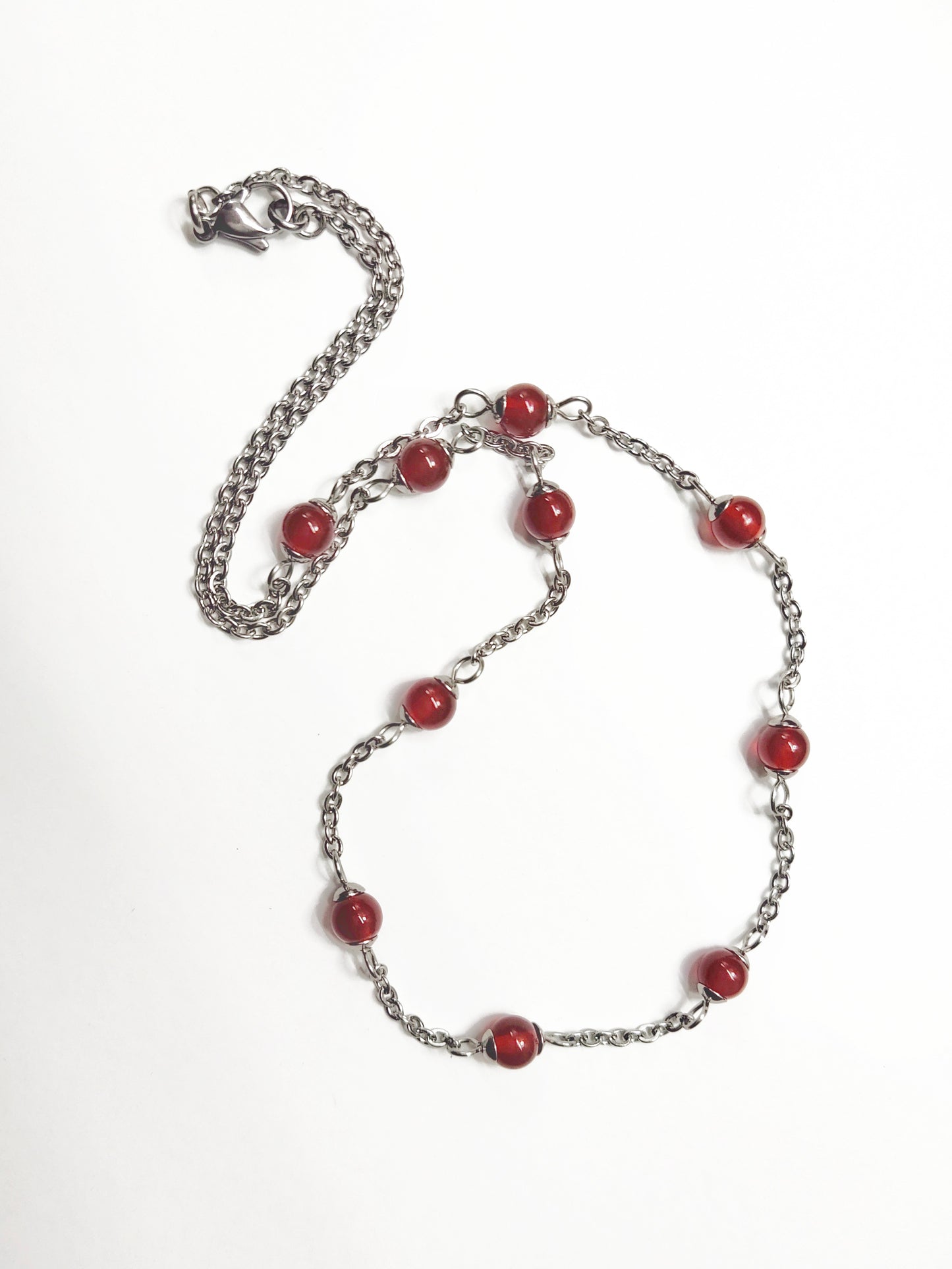 Two matching necklaces with semi-translucent reddish brown stones and a pendant #0006