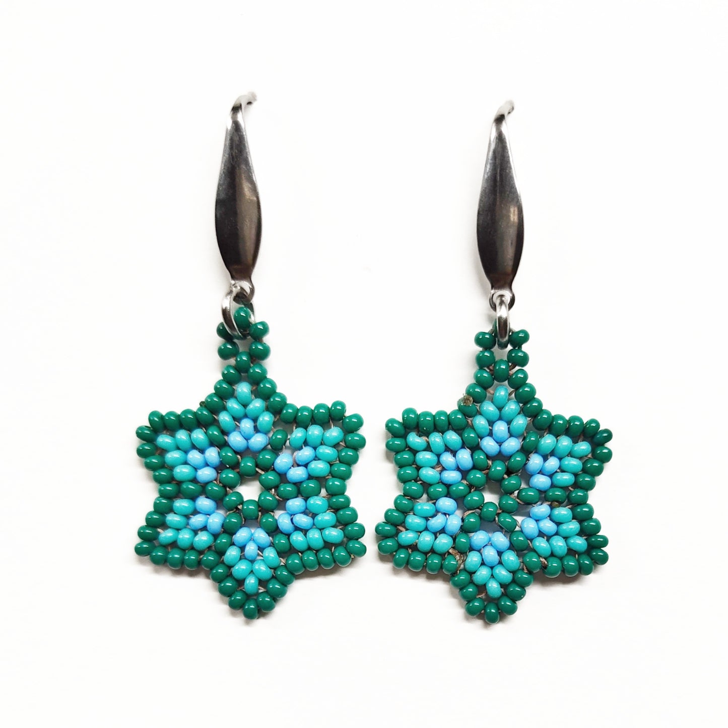 Dark bluish green beaded star earrings
