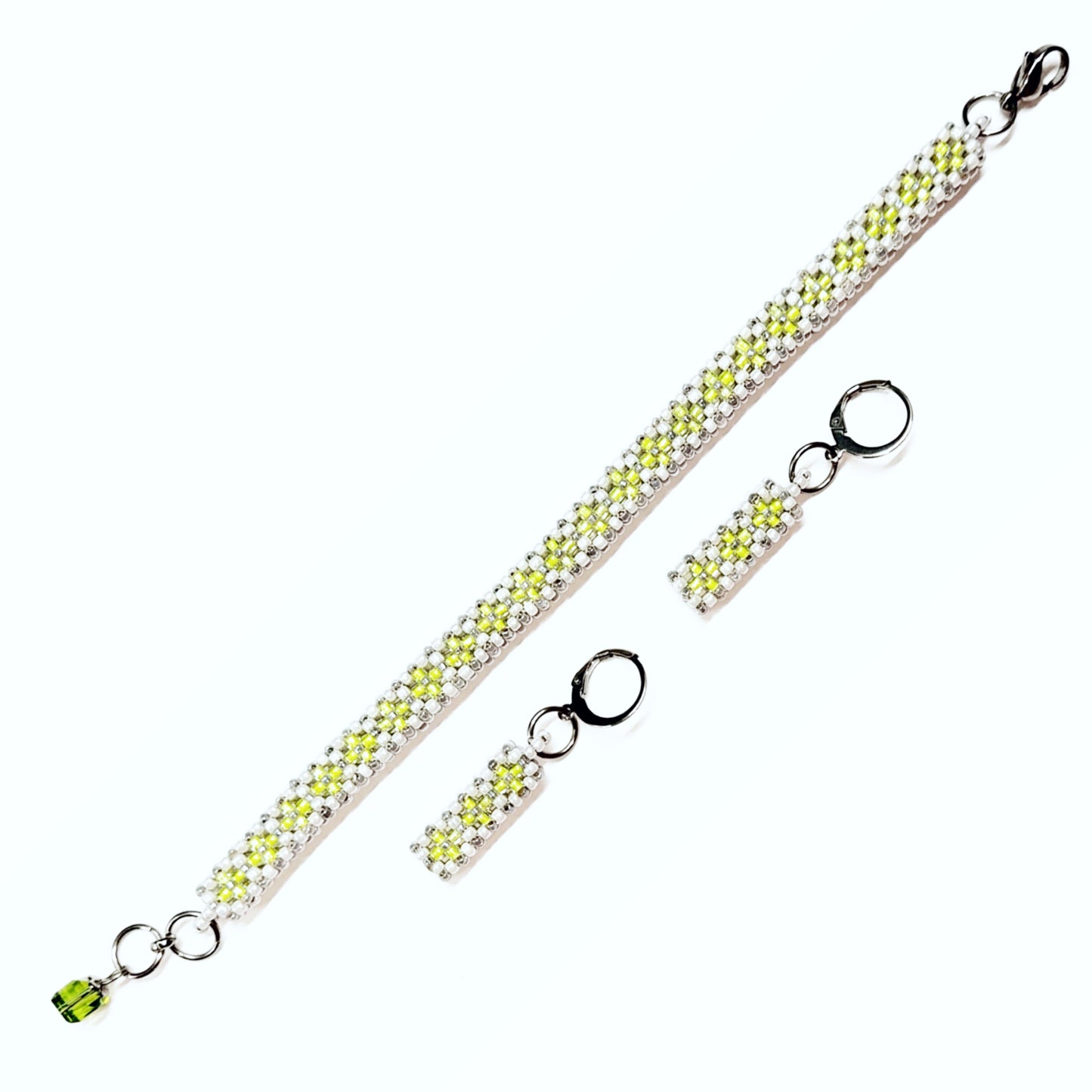 Beaded bracelet and earrings set in white, greyish silver and neon green colour